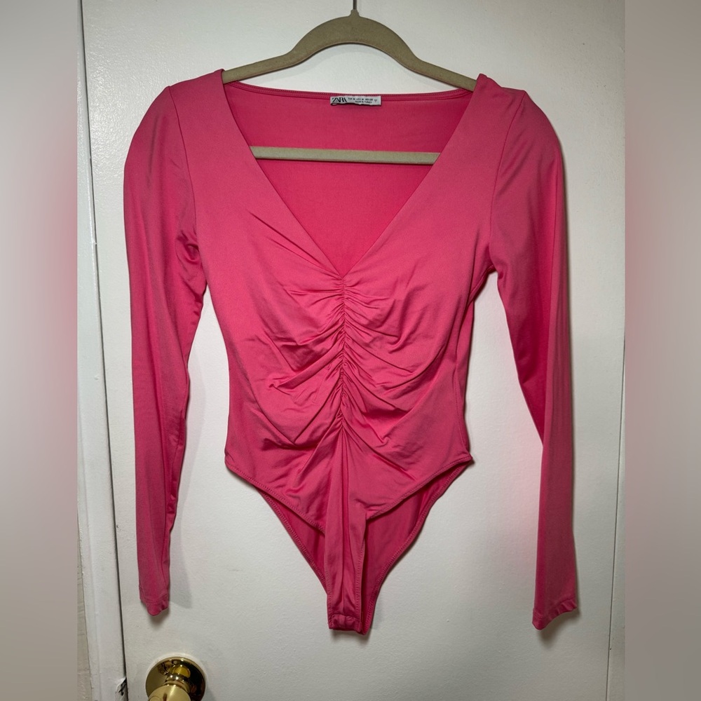 Pink bodysuit size medium.
